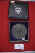 A Third Reich “Blut und Boden” commemorative medallion, dark metal example depicting eagle and