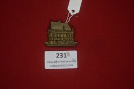 German municipal or regional commemorative badge, shield-shaped depicting a civic building,