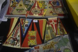 A substantial group of continental souvenir pennants and cloth banners, triangular and swallowtail