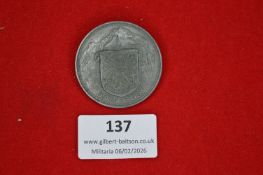 Austrian patriotic commemorative badge, circular grey metal issue depicting mountain landscape