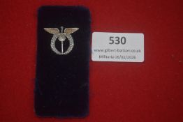 German political stick pin, wreath surmounted by eagle and sword motif, silvered finish, mounted