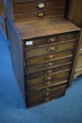 Tall wooden collector’s cabinet, fitted ten graduated drawers with brass knob handles, rectangular