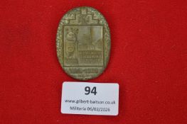 German veterans’ or memorial badge, oval form with wreath border, featuring civic arms and