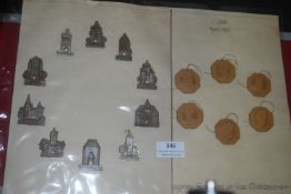 A mounted display of German commemorative and WHW items, including metal architectural plaques