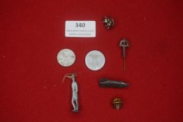 A mixed group of German badges and small objects, including a 1944-dated Third Reich coin, WHW-style