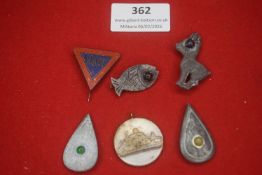A small mixed group of German novelty and souvenir badges, including a triangular Halt road sign