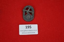 German workers’ or trade association badge, oval openwork form depicting crossed hammer and sword