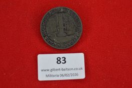 German commemorative badge featuring a monument within a circular border, dated 1923–1925.