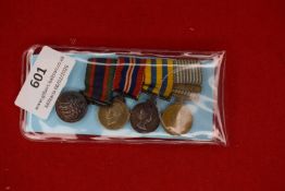 Group of four miniature dress medals including 1939–45 Star, War Medal 1939–45, Defence Medal, and