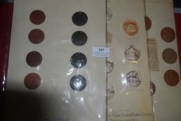 A mounted group of German ceramic medallions, circular examples in brown and black finishes, each