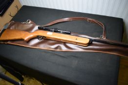 BSA Mercury.22 calibre break-barrel air rifle, fitted with a telescopic sight, wooden stock with