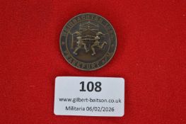 German civic or festival commemorative badge, circular bronze issue depicting two running child