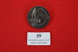 German Third Reich Blut und Boden commemorative badge, circular dark metal example depicting eagle