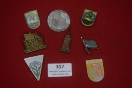 A mixed group of German enamelled and metal badges, including civic, regional and architectural