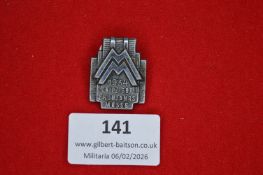 German trade fair commemorative badge, architectural silvered metal issue depicting stylised