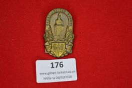 German regional commemorative badge depicting a tower flanked by trees above a heraldic shield,