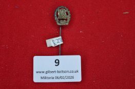 German stickpin with intertwined letter monogram within wreath, silvered example, reverse pierced