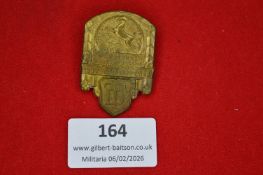 German gymnastics association commemorative tinnie, architectural form with rearing horse motif,