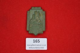 German regional commemorative tinnie, architectural form depicting a ruined castle and grapevine