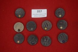 A group of German zodiac-themed stone or composite WHW badges, circular form, each engraved with