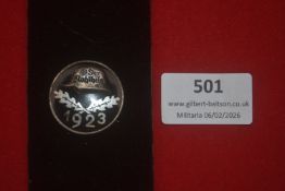 German Third Reich period badge, circular metal example dated 1923, featuring a steel helmet above