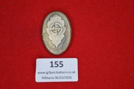 German patriotic or veterans’ association badge, oval form with central emblem and circular