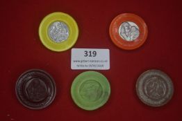 A group of German plastic and composite WHW donation badges, circular form, in various colours,