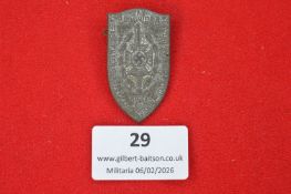 German Third Reich political commemorative badge, shield-shaped silvered example with central dagger