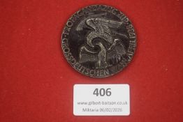 A Third Reich propaganda medal featuring an eagle and the inscription “Propagandazug Großdeutschen