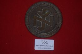 German National Socialist People’s Welfare (NSV) wall plaque, circular cast metal example bearing