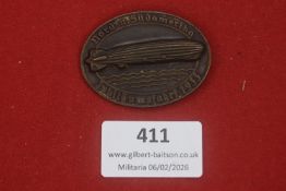A Third Reich Nord- und Südamerika Jubiläumsfahrt 1933 badge, plain bronze-finished variant