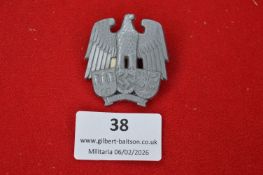 German Third Reich municipal eagle badge, die-struck grey metal example depicting eagle over