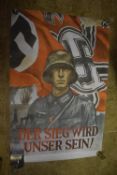 A large Third Reich propaganda poster depicting a German soldier in steel helmet before a swastika