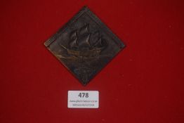 German Third Reich period metal wall plaque, diamond-shaped, depicting a sailing ship, with