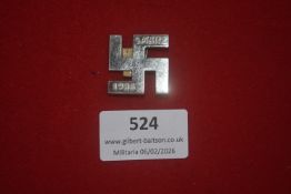 German Third Reich political commemorative badge, swastika form dated 1. März 1935, reverse marked