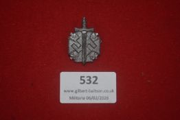 German political tinnie, shield-shaped alloy example featuring crossed flags with central sword