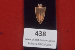 Commemorative Grunwald–Berlin Badge dated 1410–1945, bronze-toned shield-shaped example surmounted