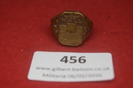 German “Westwall” ring, bronze-tone metal with raised fortress motif and “WEST WALL” legend, heavy
