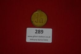 German Third Reich Winter Relief (Winterhilfswerk) donation tinnie, gilt metal, dated 1933, Gothic