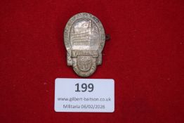 German regional festival badge, oval form depicting architectural scene with shield and