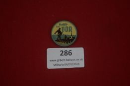 German Third Reich period enamelled badge, circular example marked “Helft im WHW”, depicting a