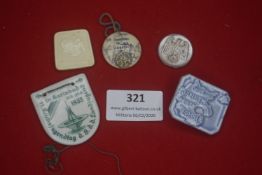 A mixed group of German WHW donation badges, in ceramic, plastic and composite materials,