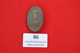 German commemorative shooting or veterans’ badge, oval form with laurel wreath border enclosing a