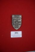 A Third Reich NSKK Motor Brigade Ostmark rally or orientation badge, shield-shaped metal example