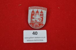 German Soltau millennial anniversary commemorative badge, shield-shaped aluminium example with red
