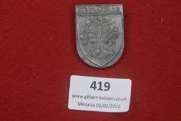 Lindau shield-shaped badge, cast metal example featuring tree motif; reverse stamped Ges. Gesch.