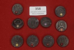 A further group of German zodiac-themed stone or composite WHW badges, circular form, depicting