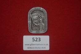 German SA Döllingen Bann Sportfest badge, dated 22 Sept. 1935, depicting SA figure holding flag with
