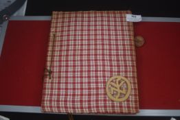 A German private photograph album, cloth-bound with checked fabric covers, containing numerous