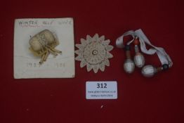 A small group of German WHW and related decorative items, including a mounted Winterhilfswerk 1937–